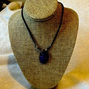Ladies, purple costume necklace with rope chain, and a purple pendant